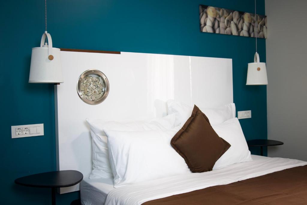 Postel nebo postele na pokoji v ubytování Hvar Riva Rooms