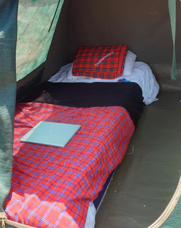 Postel nebo postele na pokoji v ubytování Oldonyo Musa Amboseli Campsite