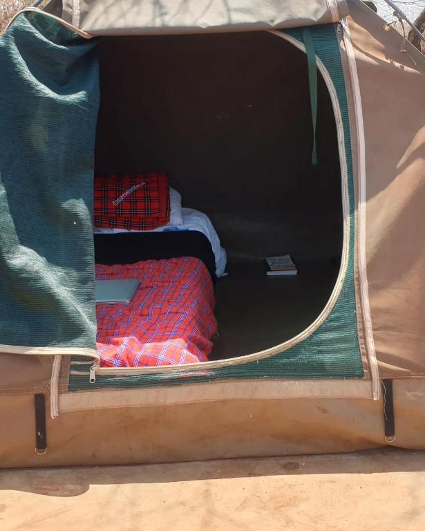 Postel nebo postele na pokoji v ubytování Oldonyo Musa Amboseli Campsite