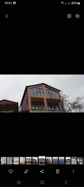 two photographs of a building in front at kotej lazi in Itʼkhvisi