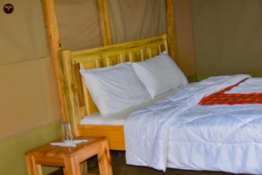 Postel nebo postele na pokoji v ubytování Oldonyo Musa Amboseli Campsite