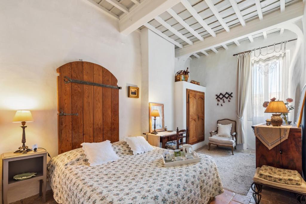 Postel nebo postele na pokoji v ubytování L'ORANGERIE Chambres d'hotes de charme