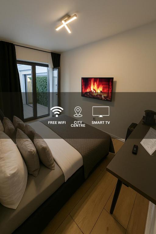 Postel nebo postele na pokoji v ubytování La Suite Hotel & Apartment, Hanau City Centre - Contactless Check-in