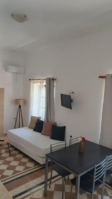 Łóżko lub łóżka w pokoju w obiekcie San Marco Guesthouse