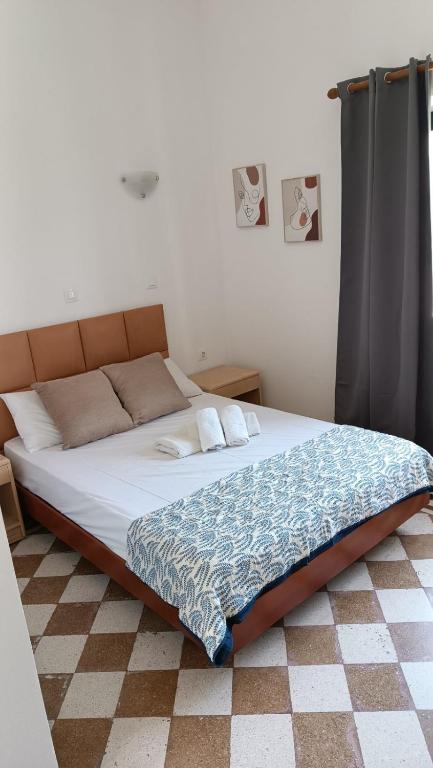 Łóżko lub łóżka w pokoju w obiekcie San Marco Guesthouse