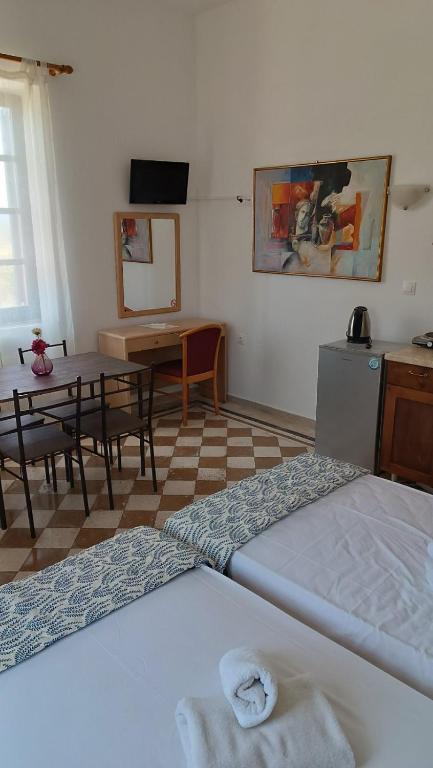 Łóżko lub łóżka w pokoju w obiekcie San Marco Guesthouse