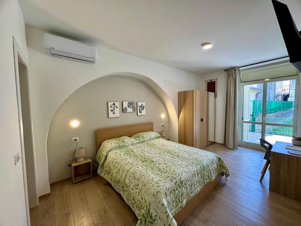 Postel nebo postele na pokoji v ubytování Cassandra Rooms