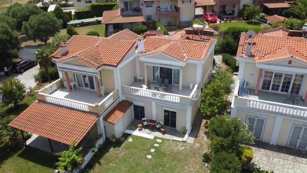 an overhead view of a large white house with red roofs at Casa Marjardin Hanioti 2025 in Hanioti