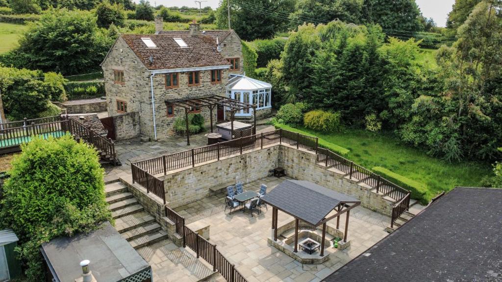 an aerial view of a house with a patio at Rural Retreat with Hot Tub, Fire Pit & Games Room in Sheffield