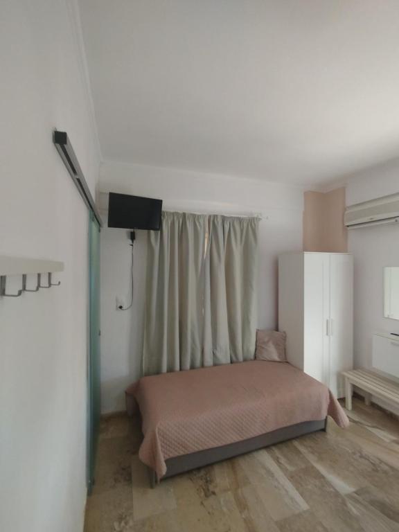 Postel nebo postele na pokoji v ubytování GIOTA ROOMS