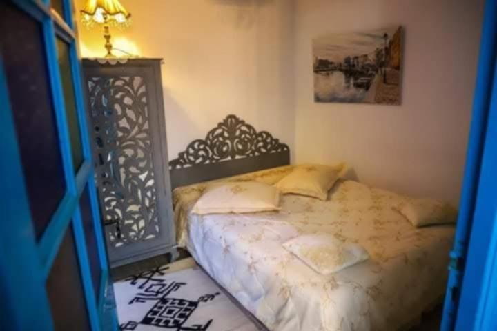 Postel nebo postele na pokoji v ubytování Dar El Kasba Riad Guest House