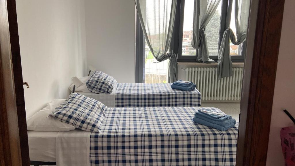 Postel nebo postele na pokoji v ubytování Guest House MICINI