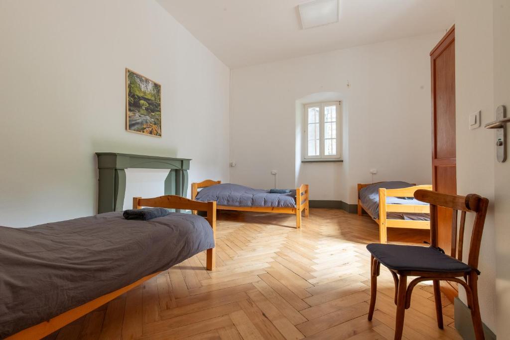 Postel nebo postele na pokoji v ubytování Monastère du Val de Consolation