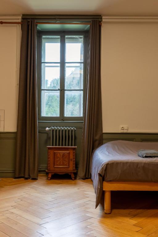 Postel nebo postele na pokoji v ubytování Monastère du Val de Consolation
