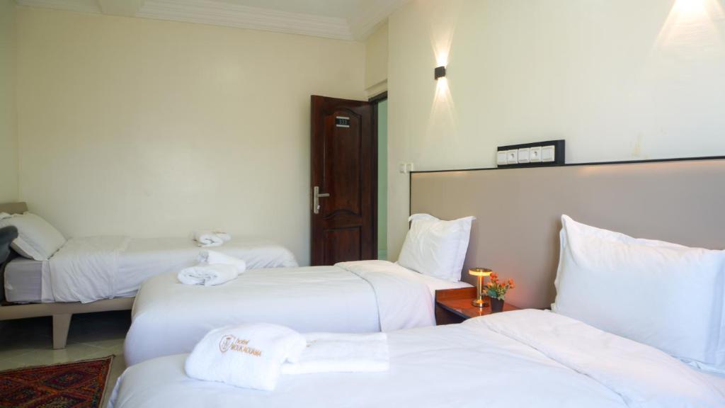 Postel nebo postele na pokoji v ubytování Hôtel Moukawama Restaurant & SPA Dakhla