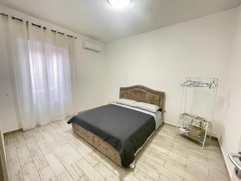 Ένα ή περισσότερα κρεβάτια σε δωμάτιο στο 2 bedroom AffittoAppartamento