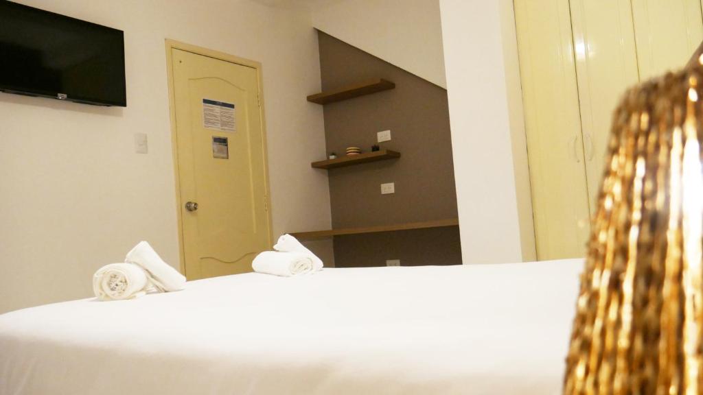 Postel nebo postele na pokoji v ubytování Park View Hostel & Suites