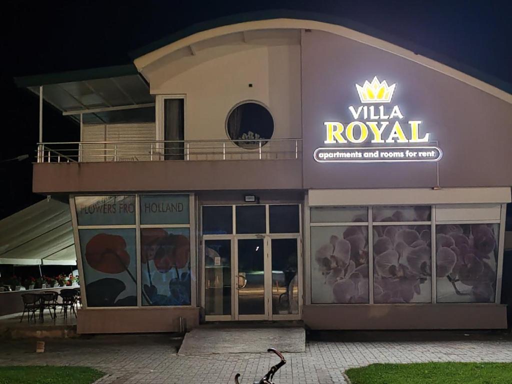 a building with a sign that reads villa royal at Villa Royal Apartments in Bitola