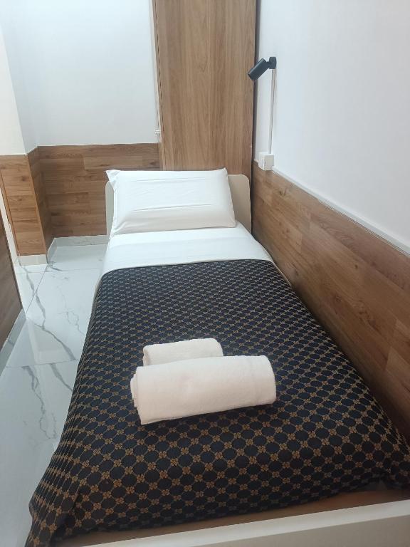 Postel nebo postele na pokoji v ubytování Roma Palace