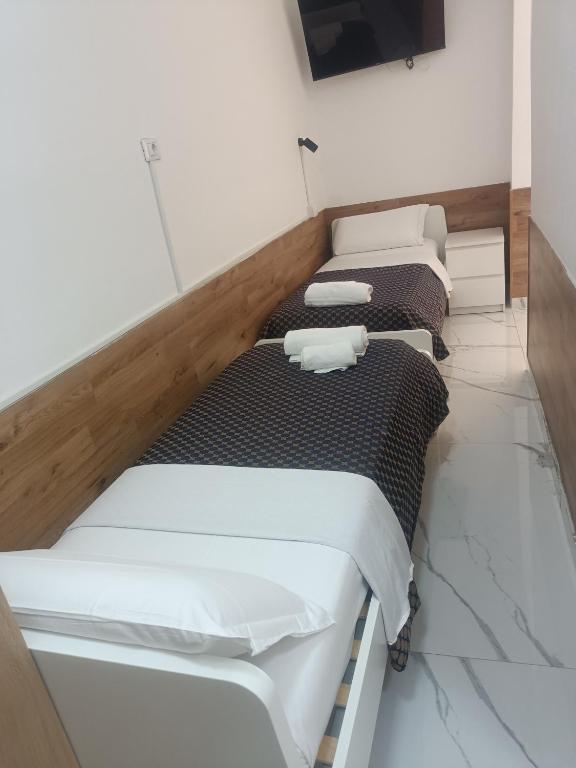 Postel nebo postele na pokoji v ubytování Roma Palace
