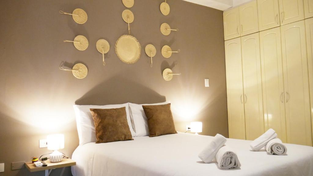 Postel nebo postele na pokoji v ubytování Park View Hostel & Suites