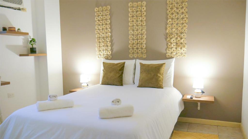Postel nebo postele na pokoji v ubytování Park View Hostel & Suites