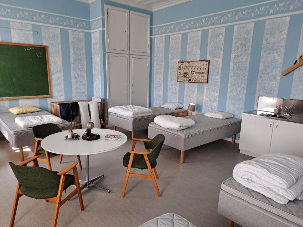 Postel nebo postele na pokoji v ubytování Skolan