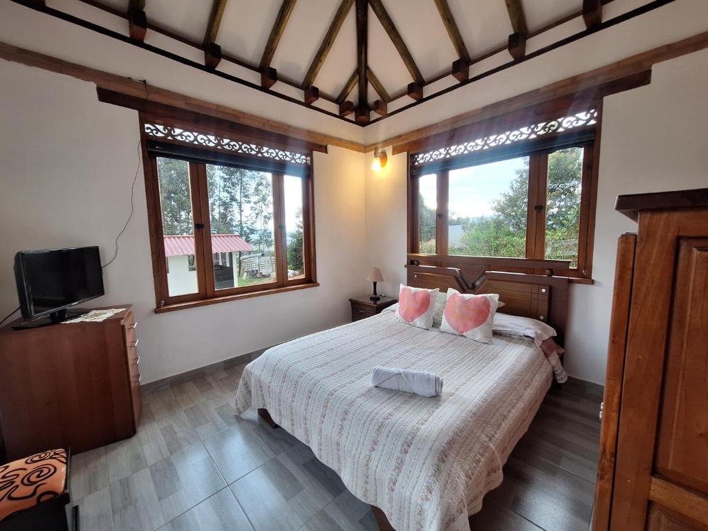 Ένα ή περισσότερα κρεβάτια σε δωμάτιο στο Chalet el portal de la Villa