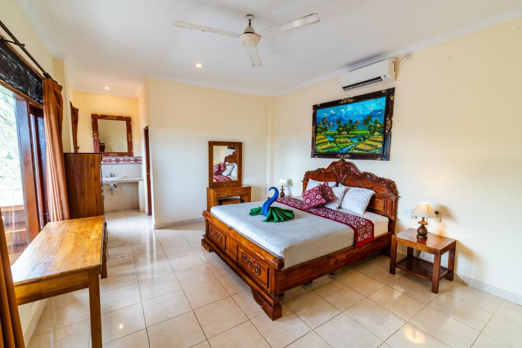 Postel nebo postele na pokoji v ubytování Rena House Ubud