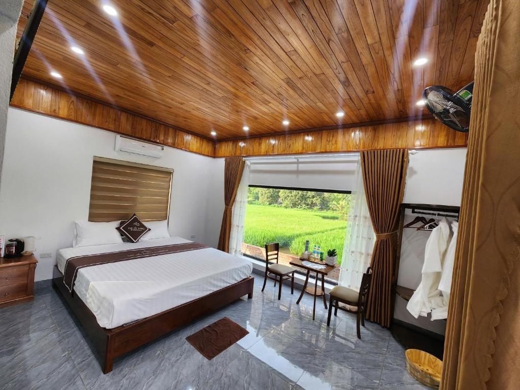 En eller flere senge i et værelse på Tam Coc Kamili Bungalow & Homestay