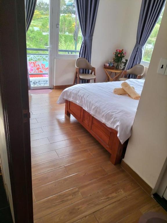 Postel nebo postele na pokoji v ubytování KHÁNH AN HOTEL