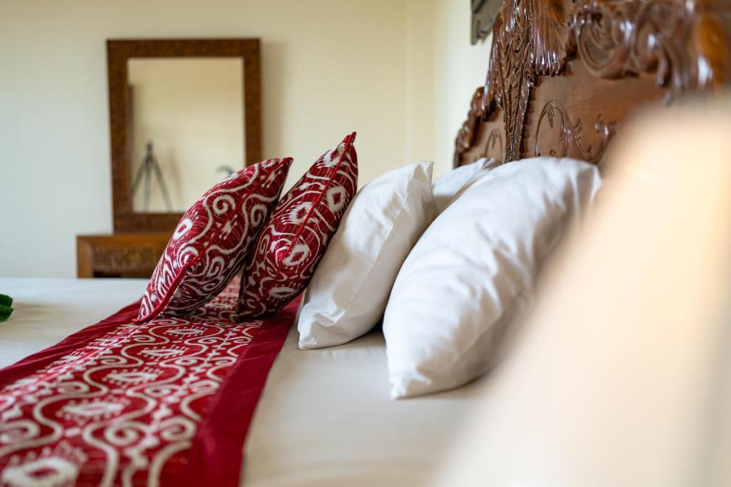 Postel nebo postele na pokoji v ubytování Rena House Ubud
