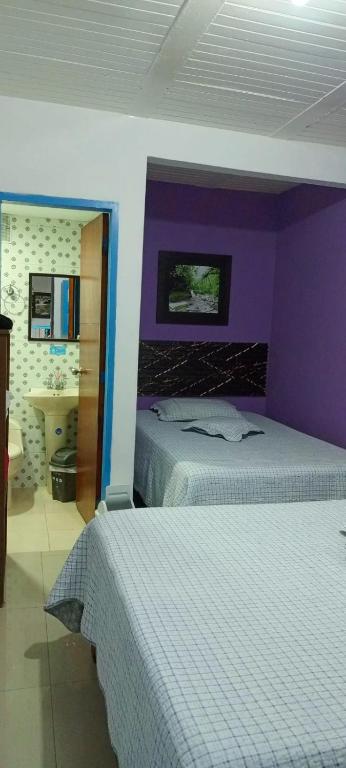 Letto o letti in una camera di Hostal Bosque de Niebla