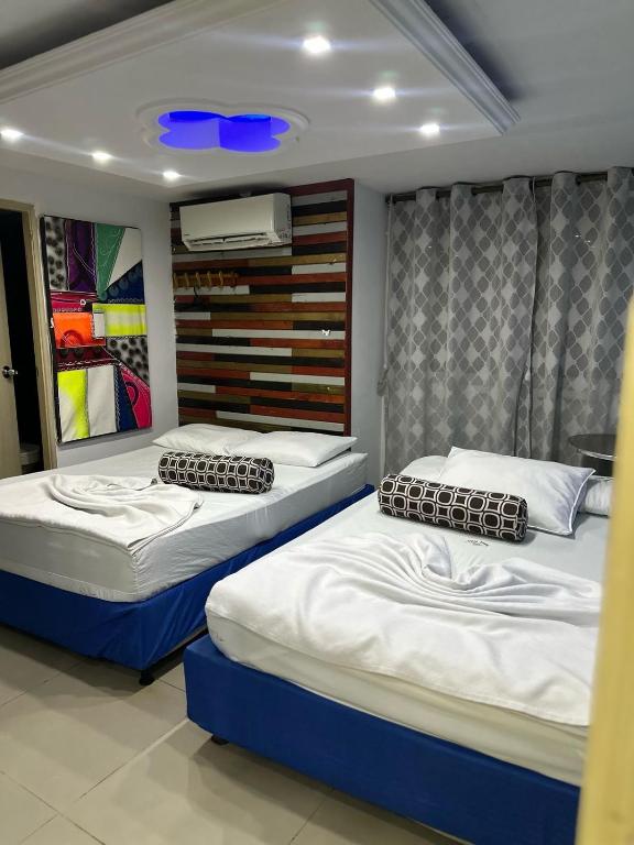 Postel nebo postele na pokoji v ubytování tocore suites beach