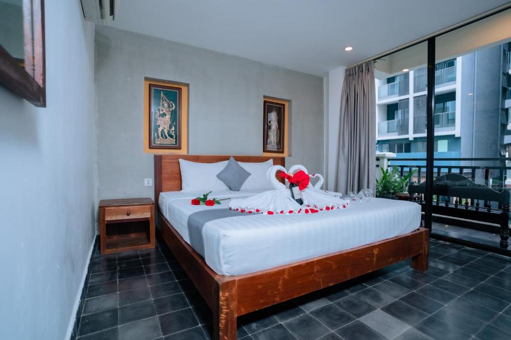 Postel nebo postele na pokoji v ubytování Home Chic Hotel