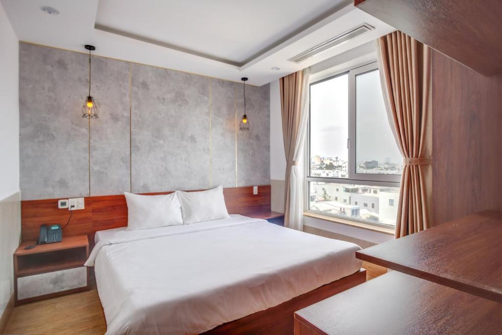 Postel nebo postele na pokoji v ubytování Phan Van 2 hotel