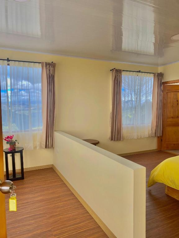 Postel nebo postele na pokoji v ubytování Inti Amanta Lodge