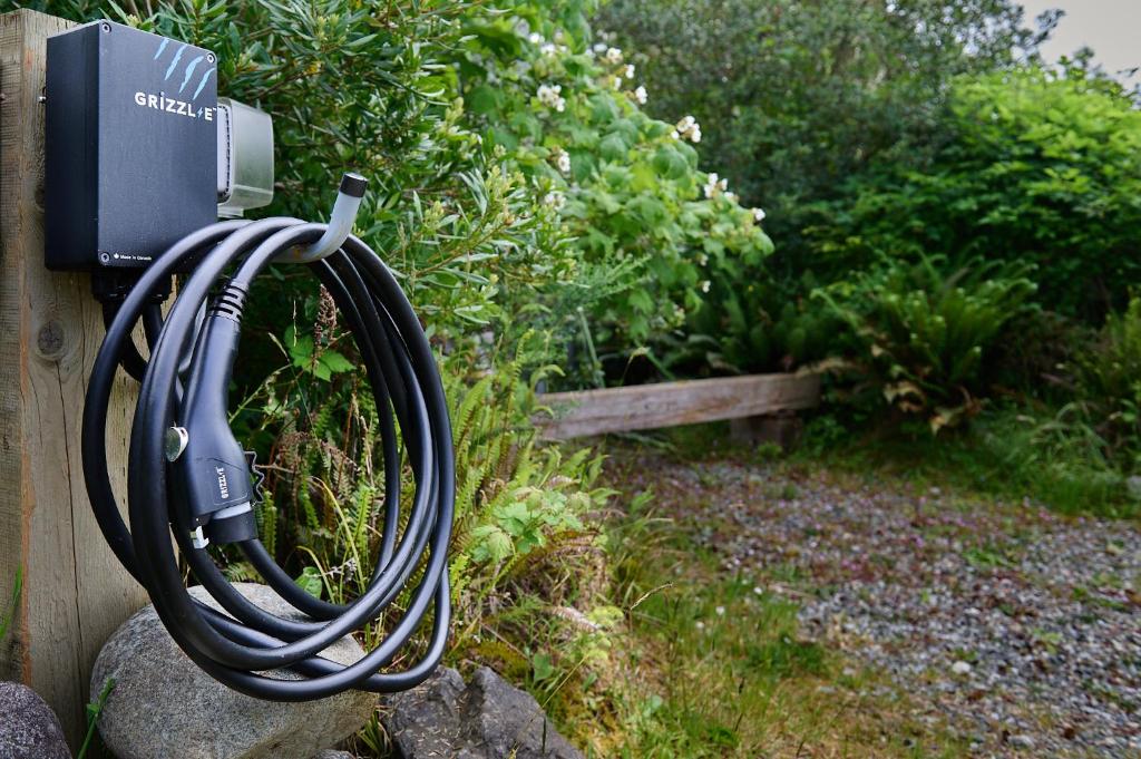 a hose is hooked up to a meter at Liahona Guest House in Ucluelet
