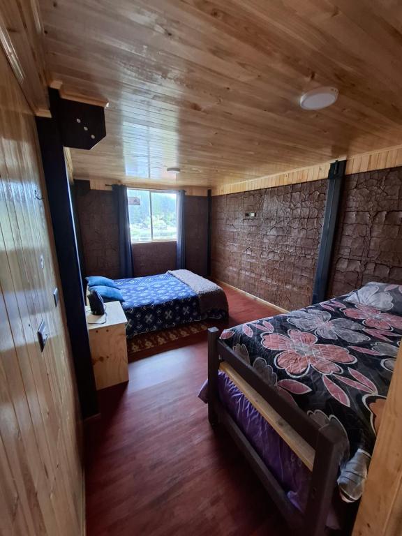Postel nebo postele na pokoji v ubytování Departamentos Espacio Rio Chovellen