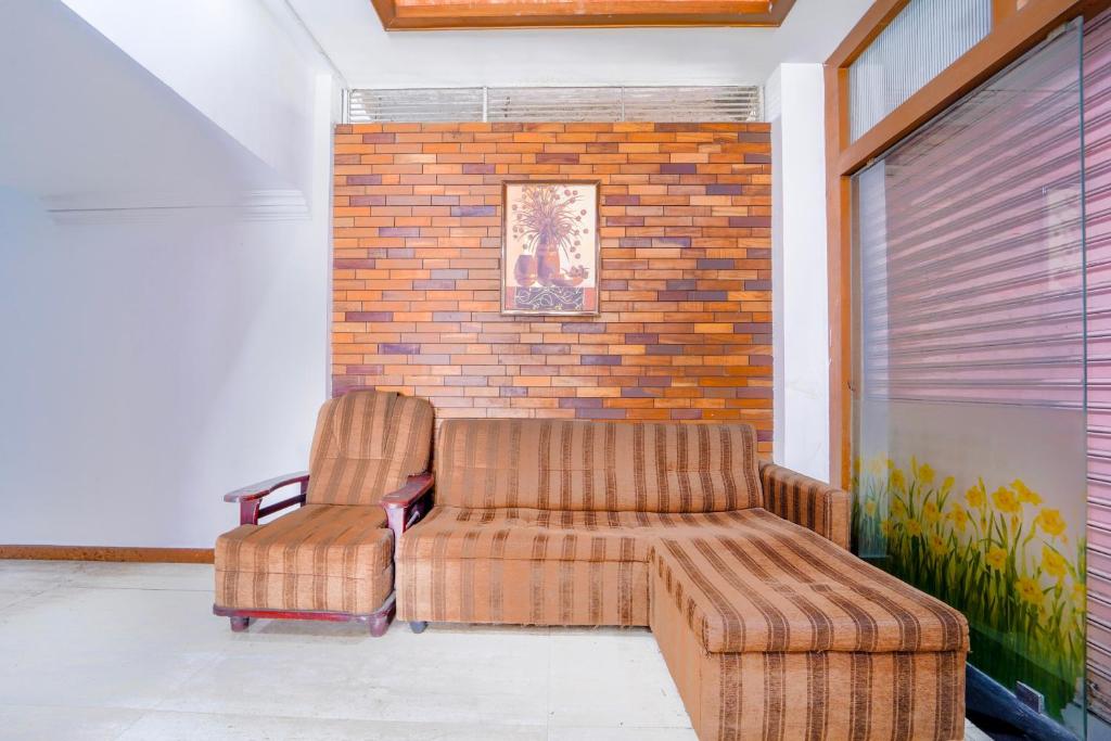Posezení v ubytování Super Townhouse City Center Ernakulam