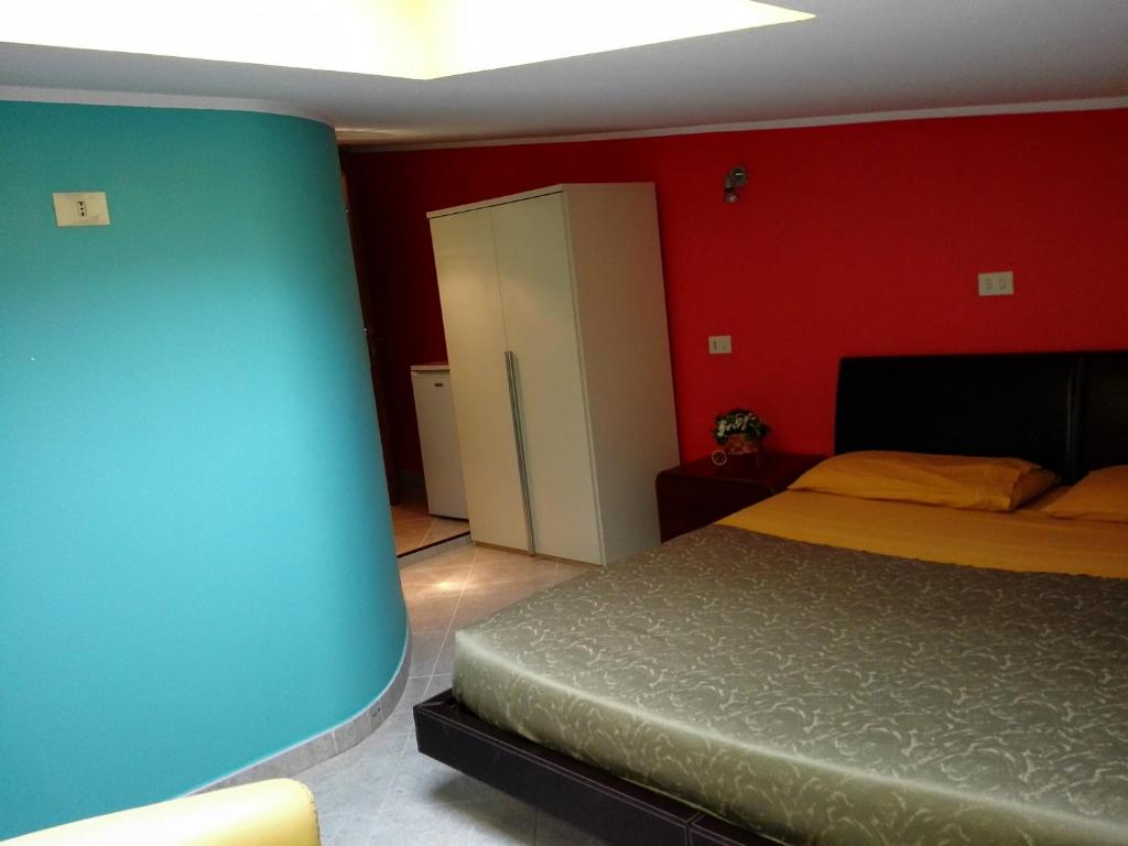 Postel nebo postele na pokoji v ubytování Albergo B&B Ristorante Grace