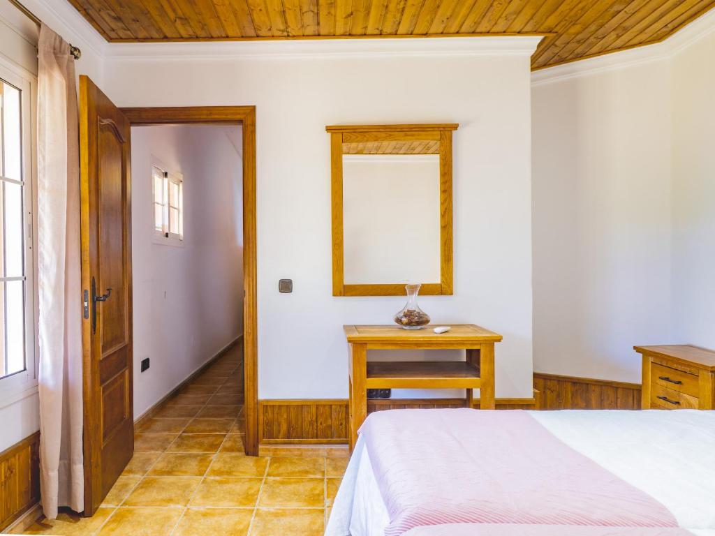 Łóżko lub łóżka w pokoju w obiekcie Cubo's Casa La Dehesilla High Privacy and Pool