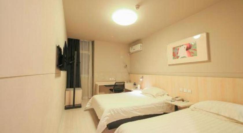 Voodi või voodid majutusasutuse JinJiang Inn Datong Pingchengqiao toas