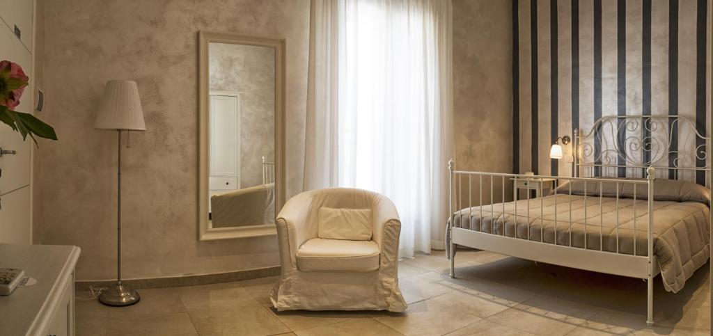 Postel nebo postele na pokoji v ubytování Relais La Pretura