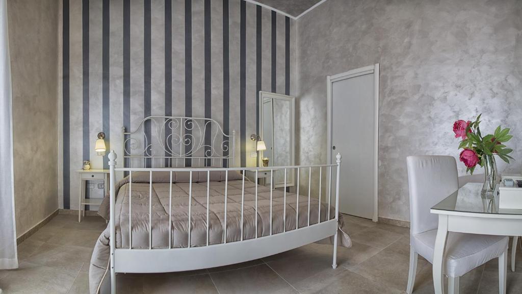 Postel nebo postele na pokoji v ubytování Relais La Pretura
