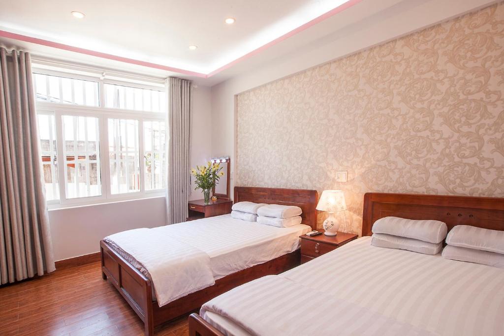 Giường trong phòng chung tại Phuong Nam Guest House