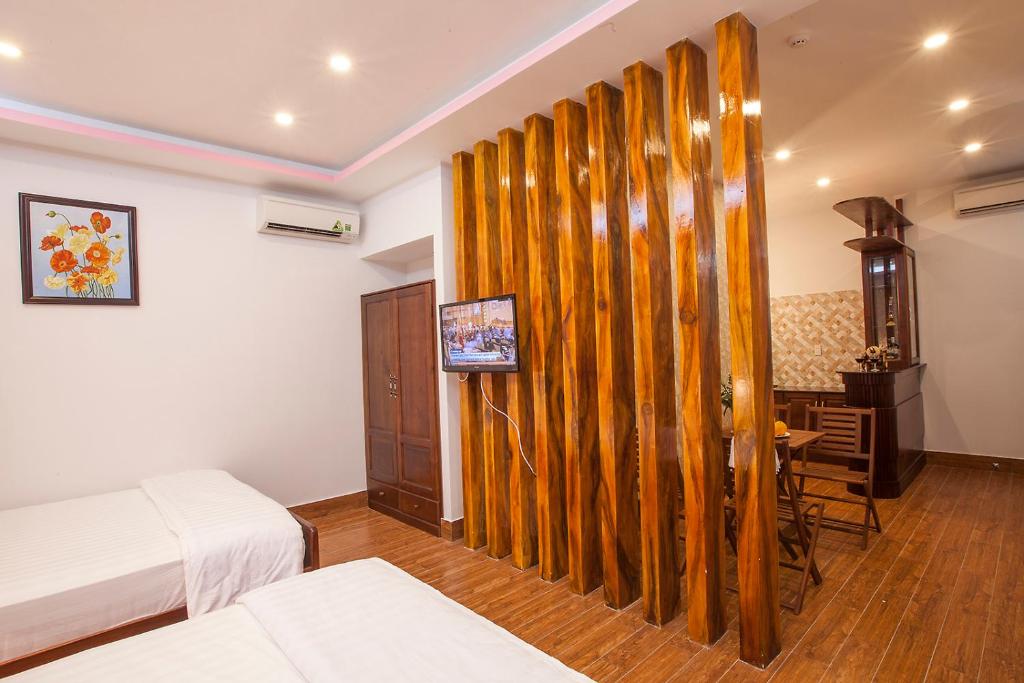 Giường trong phòng chung tại Phuong Nam Guest House