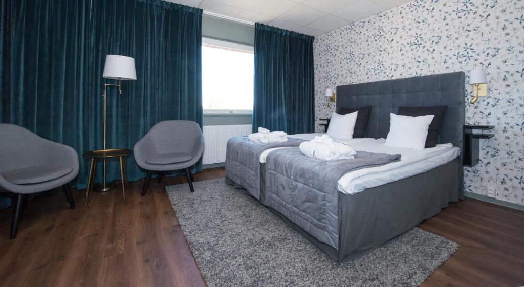 Postel nebo postele na pokoji v ubytování Quality Hotel Galaxen