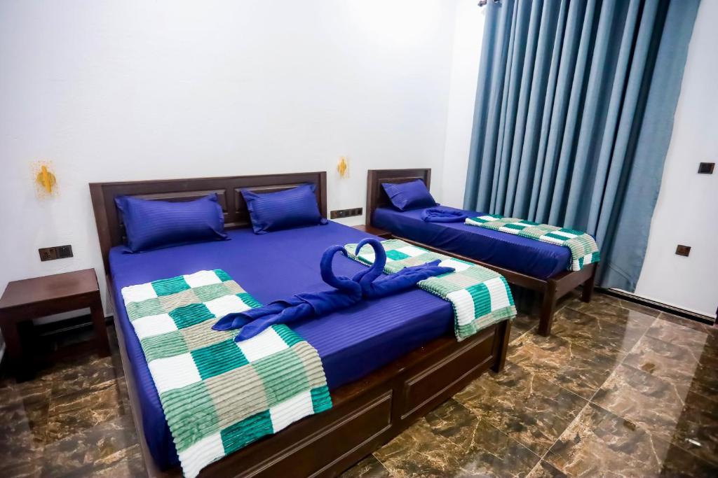 Postel nebo postele na pokoji v ubytování Oval Bay Resort