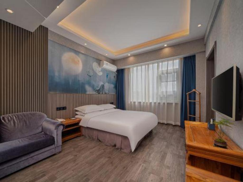 Postel nebo postele na pokoji v ubytování Xi'an Huiya Tianmu Hotel